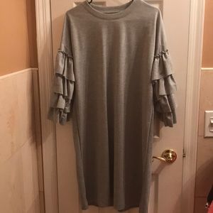 Chic knee length dress with ruffle arms!